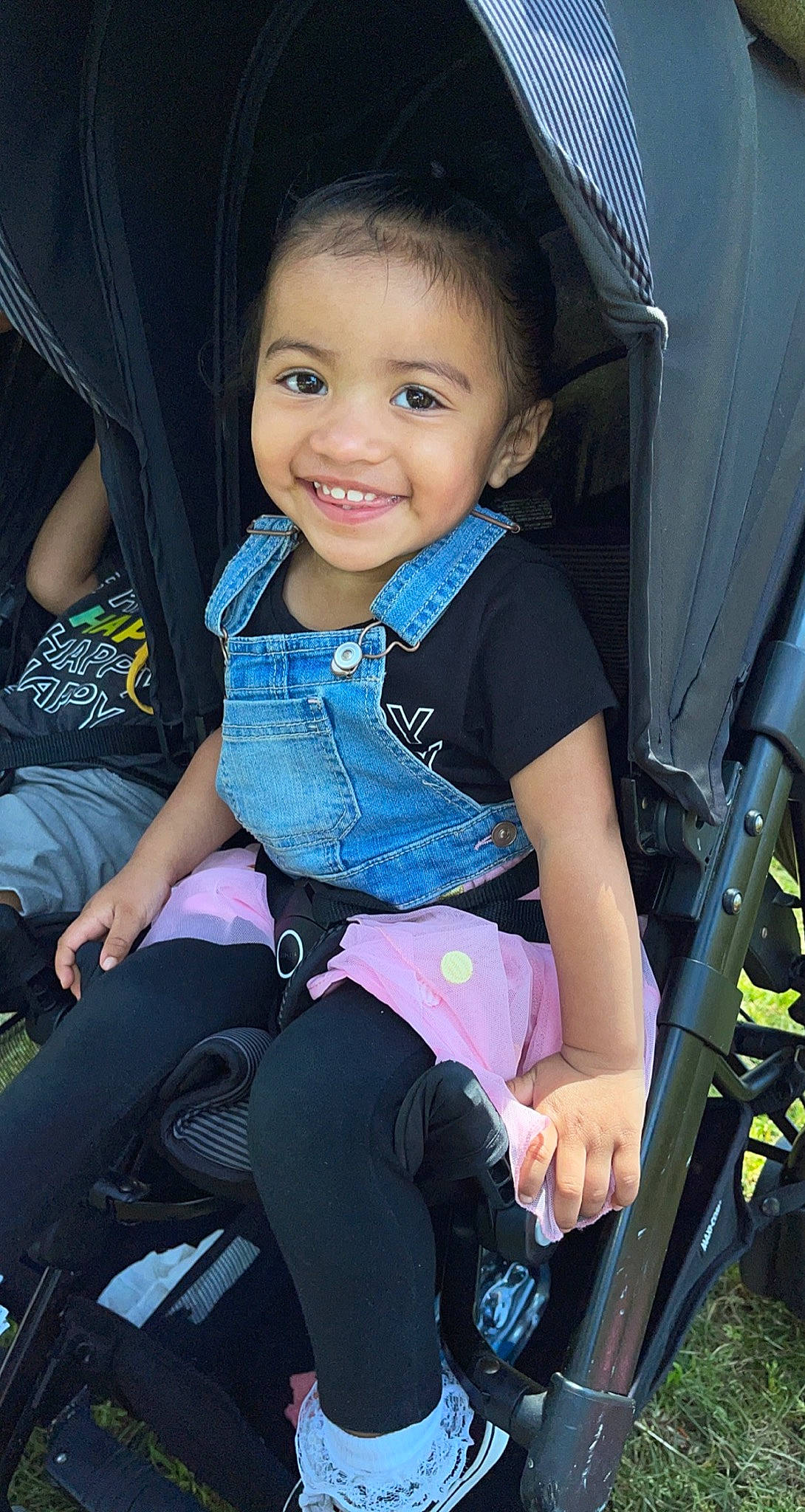 Haley is registered to the contest to win money with this photo: auto_part, baby_carriage, baby_toddler_clothing, black, cool, electric_blue, facial_expression, flash_photography, fun, happy, human, iris, joy, lap, organ, person, photograph, skin, smile, snapshot