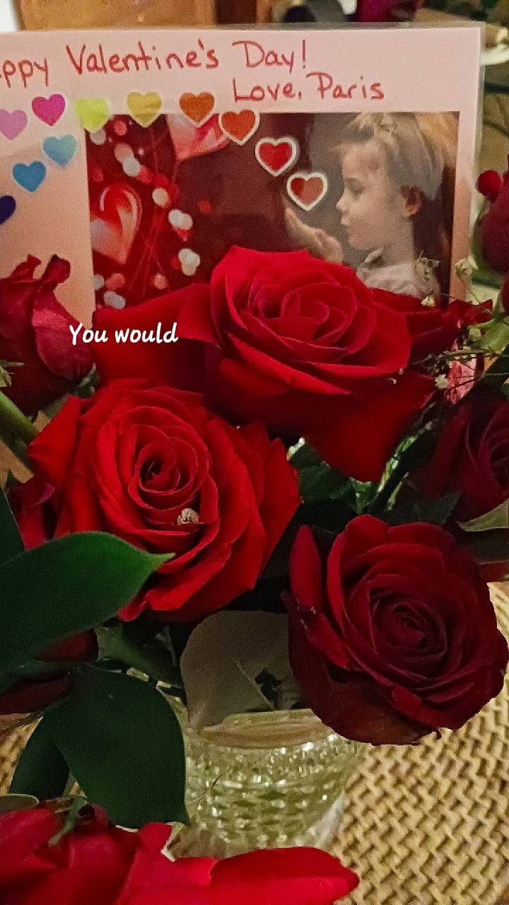 Paris is registered to the contest to win money with this photo: artificial_flower, beauty, botany, bouquet, creative_arts, cut_flowers, electric_blue, flower, flower_arranging, flowering_plant, font, garden_roses, hybrid_tea_rose, person, petal, pink, plant, red, rose, rose_family