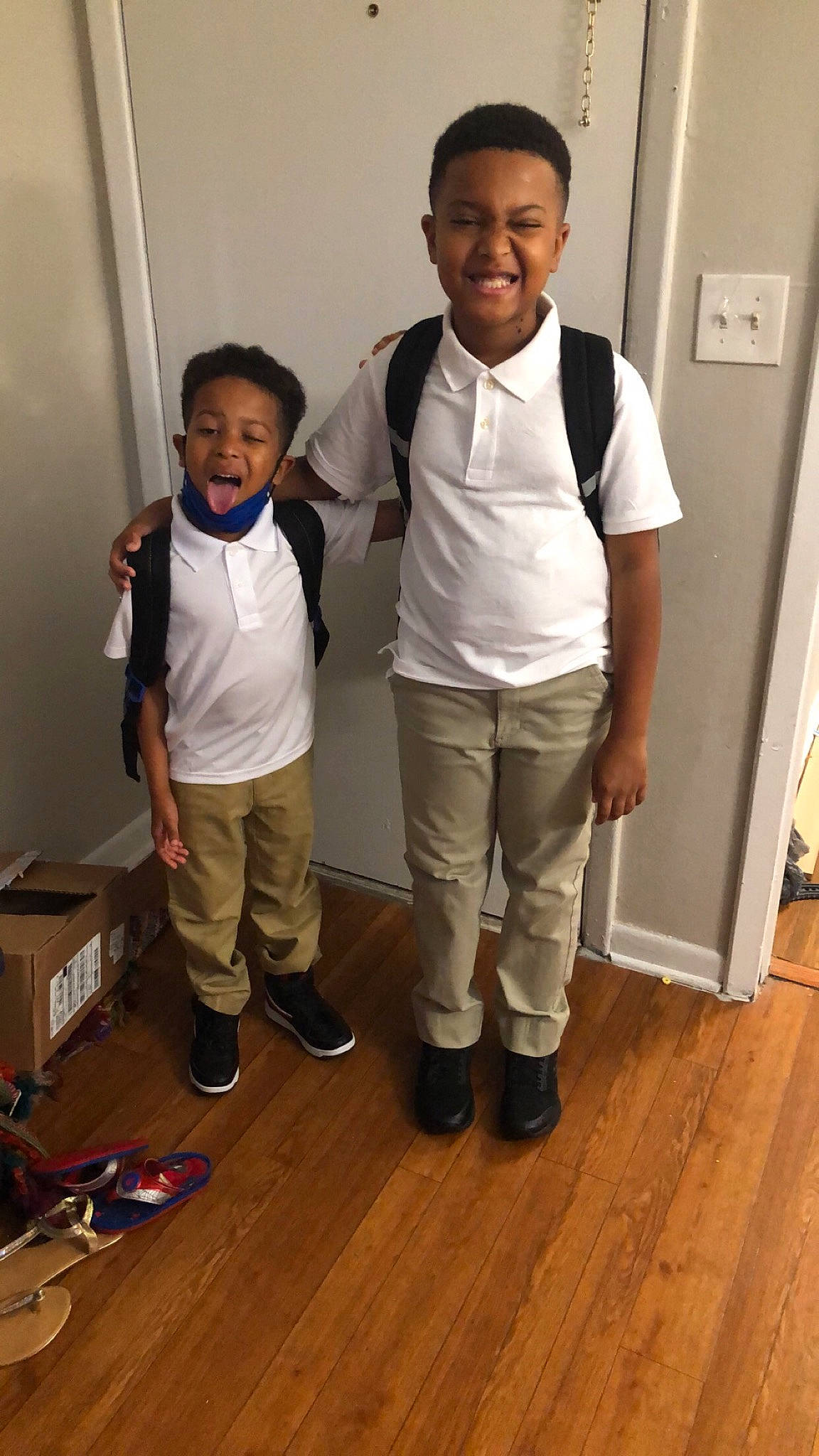 Kyren joined the competition — help win amazing prizes! bag, box, event, face, floor, flooring, hardwood, head, joy, laminate_flooring, luggage_and_bags, office_supplies, person, shipping_box, sleeve, smile, sneakers, t_shirt, varnish, wood