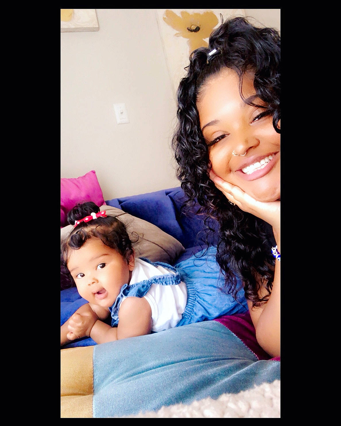 Adrienne is registered to the contest to win money with this photo: arm, baby, child, comfort, dress, electronic_device, face, facial_expression, flash_photography, fun, gesture, hair, hairstyle, happy, human_body, joy, magenta, person, purple, skin