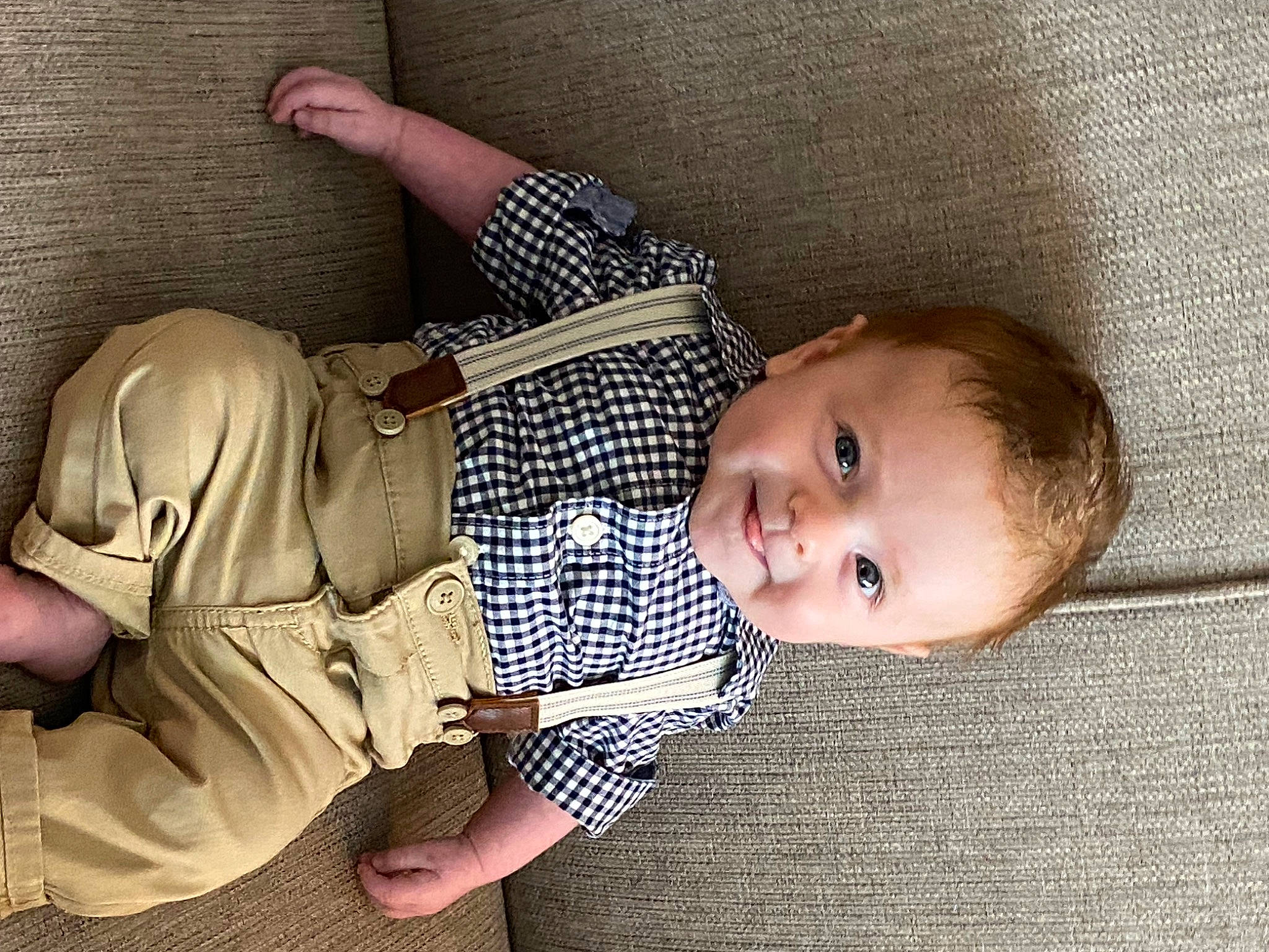 Landon is registered to the contest to win money with this photo: baby, baby_toddler_clothing, cheek, child, comfort, facial_expression, finger, gesture, joy, leg, linens, mammal, nose, person, skin, sleeve, smile, textile, thumb, toddler