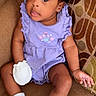 Novah joined the competition — help win amazing prizes! baby, child, infant, girl, purple_dress, pink_bow, sock, mitten, couch, patterned_cushion, seated, curious_expression, indoors, cute, portrait, smiling, comfortable, soft_lighting, young_child, casual