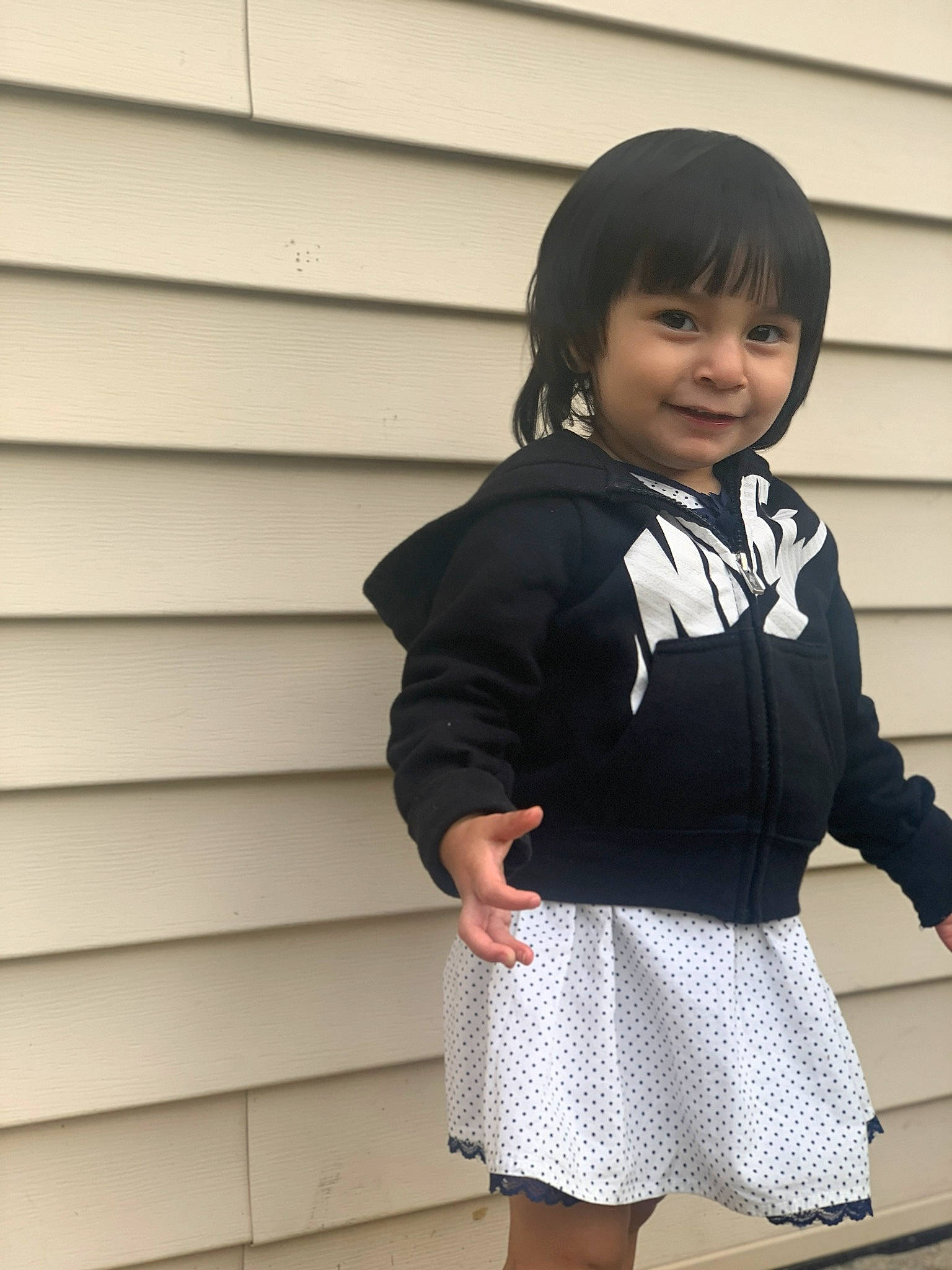 Aileen is registered to the contest to win money with this photo: child, clothing, outerwear, person, photography, school_uniform, smile, toddler, uniform