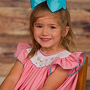 Marley is registered to the contest to win money with this photo: accessories, bodypart, child, clothing, dress, eveningdress, face, female, finger, formalwear, girl, happy, hardwood, hat, head, person, photography, portrait, smile, wood