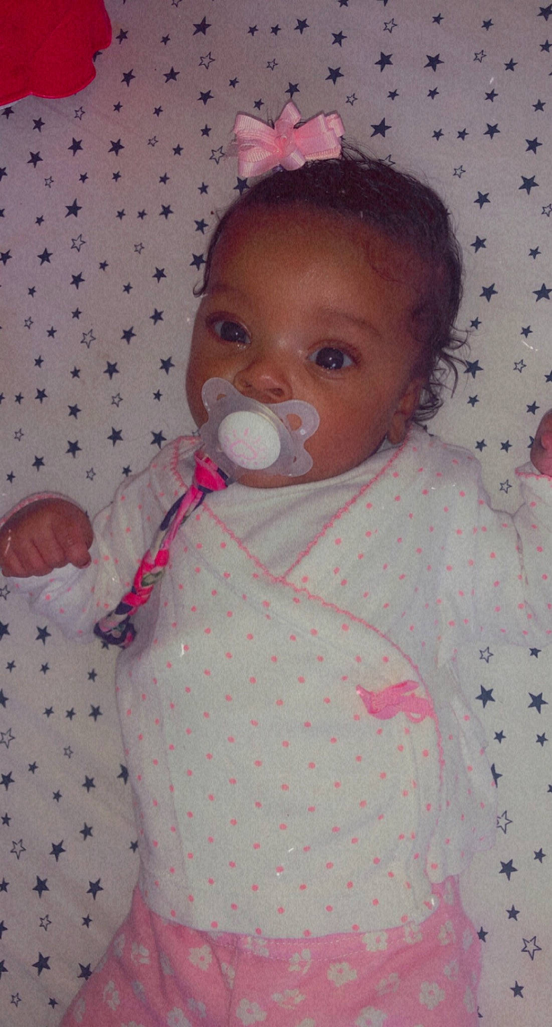 Malani is registered to the contest to win money with this photo: baby, baby_products, baby_toddler_clothing, baby_toys, button, cheek, child, hair_accessory, linens, party_supply, pattern, peach, person, pink, polka_dot, toddler