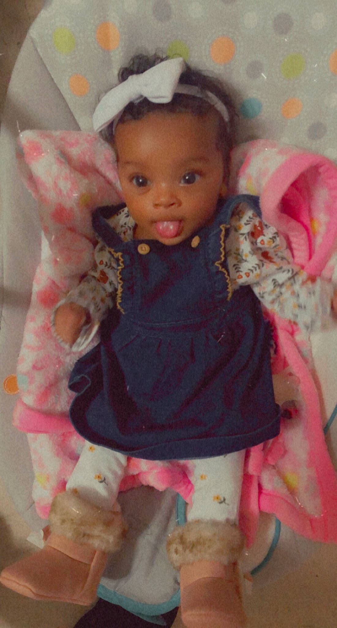 Malani is registered to the contest to win money with this photo: baby, baby_products, baby_toddler_clothing, cheek, child, costume_accessory, day_dress, embellishment, fawn, hair_accessory, headband, headpiece, nose, peach, person, pink, sock, toddler