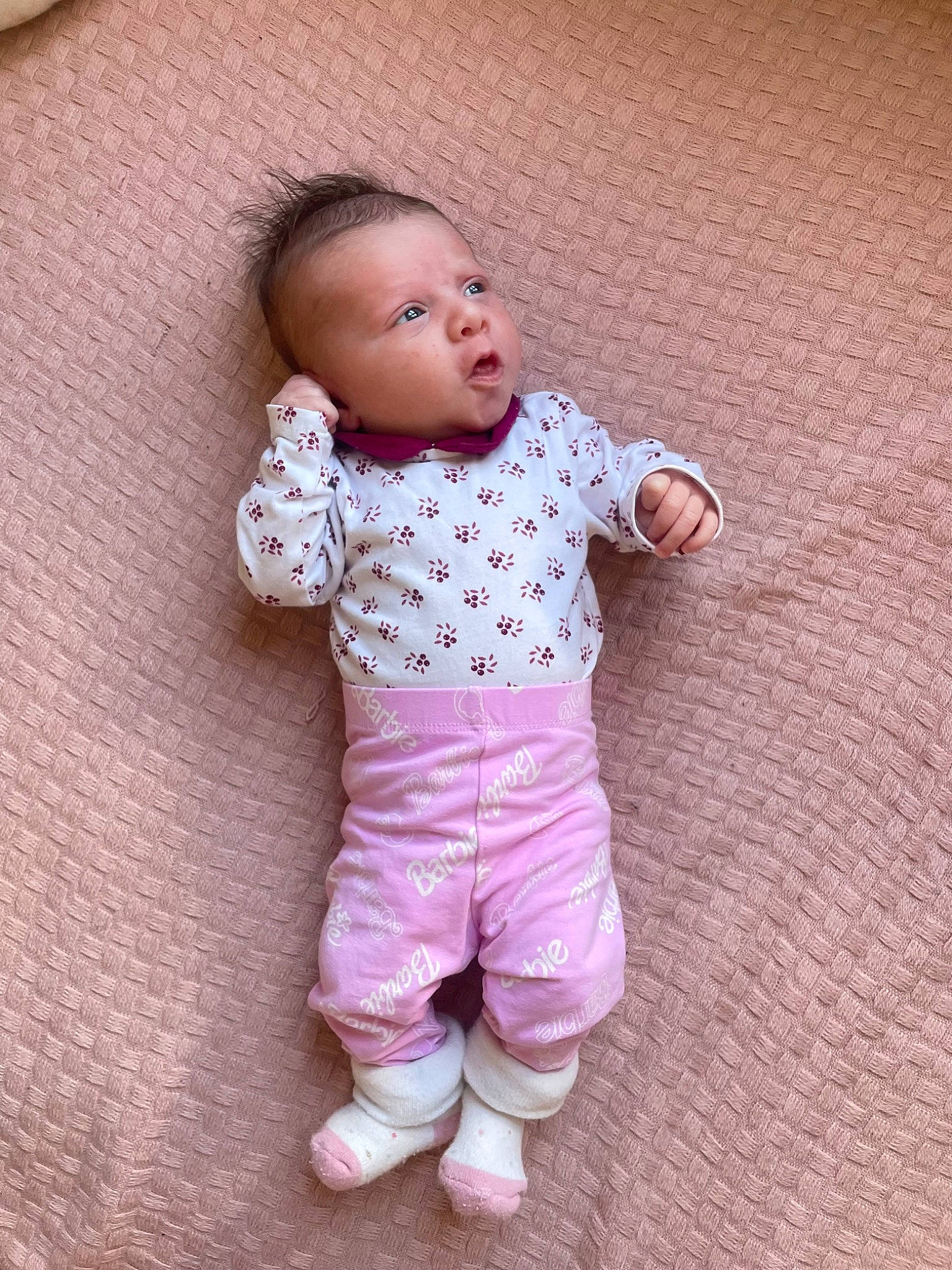 Ella participe au concours pour gagner de l'argent avec cette photo : baby, baby_toddler_clothing, cheek, child, chin, collar, comfort, eye, face, flooring, gesture, happy, head, nose, outerwear, pattern, person, pink, skin, sleeve