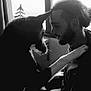 black_and_white, man, dog, pet, window, indoor, portrait, beard, long_hair, paw, touching, friendship, love, silhouette, calm, intimate, side_view, human, animal, interaction