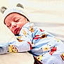 baby, newborn, sleeping, onesie, hat, bear_ears, pillow, sleep, cute, infant, child, bed, blanket, soft, cozy, indoors, clothing, peaceful, rest, portrait