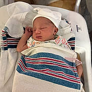 Keona joined the competition — help win amazing prizes! newborn, baby, sleeping, hospital, blanket, bassinet, cap, infant, swaddled, bed, healthcare, patient, peaceful, soft, clothing, person, nursery, newlife, rest, indoors