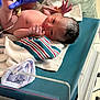 Keona joined the competition — help win amazing prizes! newborn, baby, hospital, bassinet, blanket, gloved_hand, medical, infant, striped_blanket, bed, person, skin, foot, hand, hospital_room, healthcare, cute, child, lying_down, towel