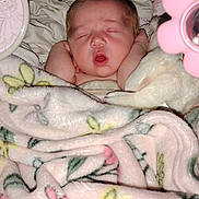 Isla joined the competition — help win amazing prizes! newborn, baby, sleeping, infant, face, portrait, blanket, bed, bedding, nursery, pink, toy, mirror, cozy, indoors, lying_down, closed_eyes, peaceful, floral, princess