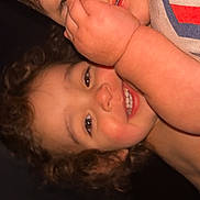Viviana is registered to the contest to win money with this photo: child, kids, faces, smiling, playful, hand, cozy_clothing, portrait, closeup, cute, happy, baby, toddler, curly_hair, skin, indoor, expression, person, warm, siblings