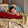 Viviana is registered to the contest to win money with this photo: toddler, child, bed, blanket, pillow, indoor, resting, face, curious, portrait, young_child, comfort, home, cozy, expression, lying_down, clothing, person, room, sleep_area