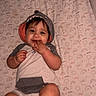Bobbie joined the competition — help win amazing prizes! baby, blanket, casual_clothing, chewing, child, closeup, cute, fingers, happy, hoodie, indoors, infant, lying_down, one_person, patterned_blanket, portrait, rainbows, shark_hood, smiling, suns