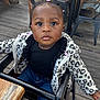 Cecelia joined the competition — help win amazing prizes! toddler, child, high_chair, jacket, heart_pattern, pink_hair_ties, jeans, wooden_floor, metal_chairs, curious_expression, outdoor, portrait, clothing, person, seat, table, black_top, baby, cute, young_child