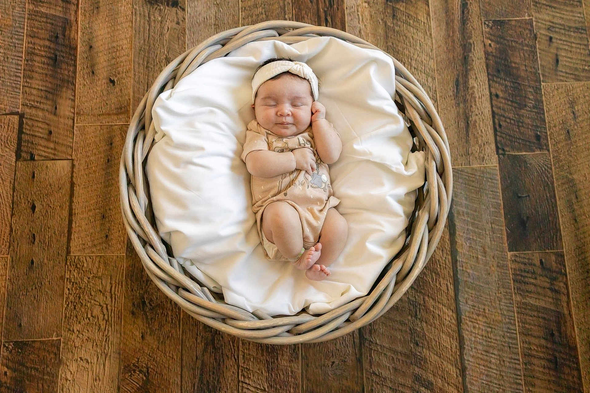 Rowan joined the competition — help win amazing prizes! baby, basket, blanket, wooden_floor, headband, infant, sleeping, onesie, indoors, cute, peaceful, cozy, soft, resting, child, newborn, portrait, flooring, relaxing, comfortable