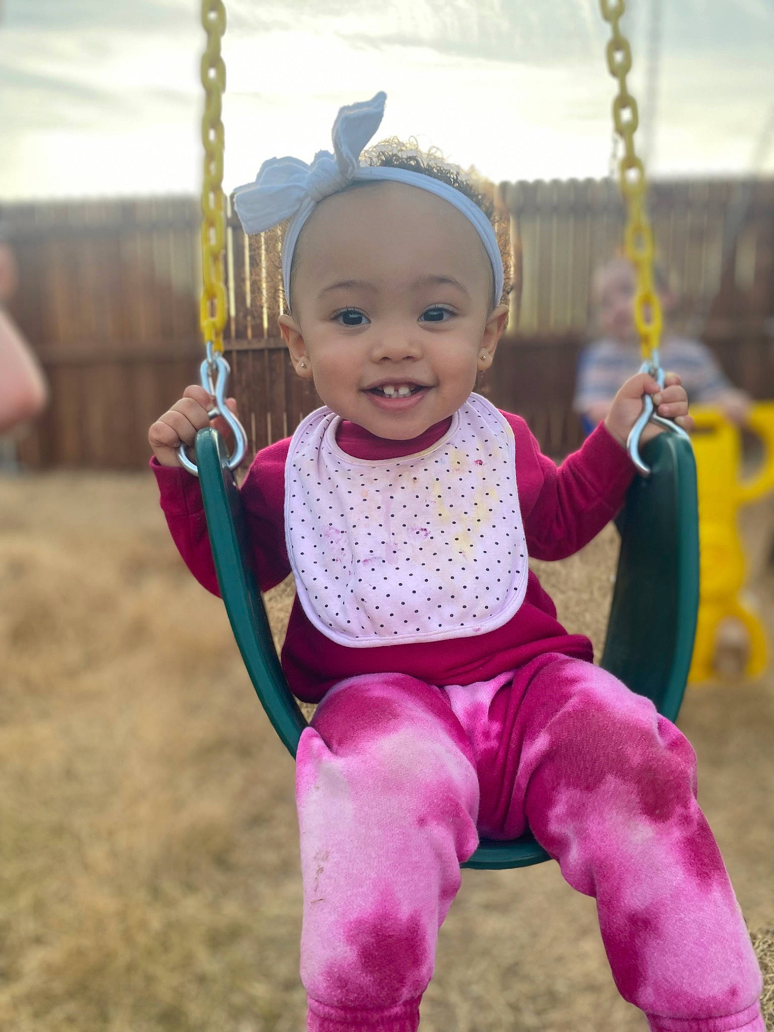 Alexandria joined the competition — help win amazing prizes! baby, baby_toddler_clothing, cool, eye, face, facial_expression, happy, head, human_body, joy, leisure, outerwear, person, pink, playground, purple, skin, sleeve, smile, swing
