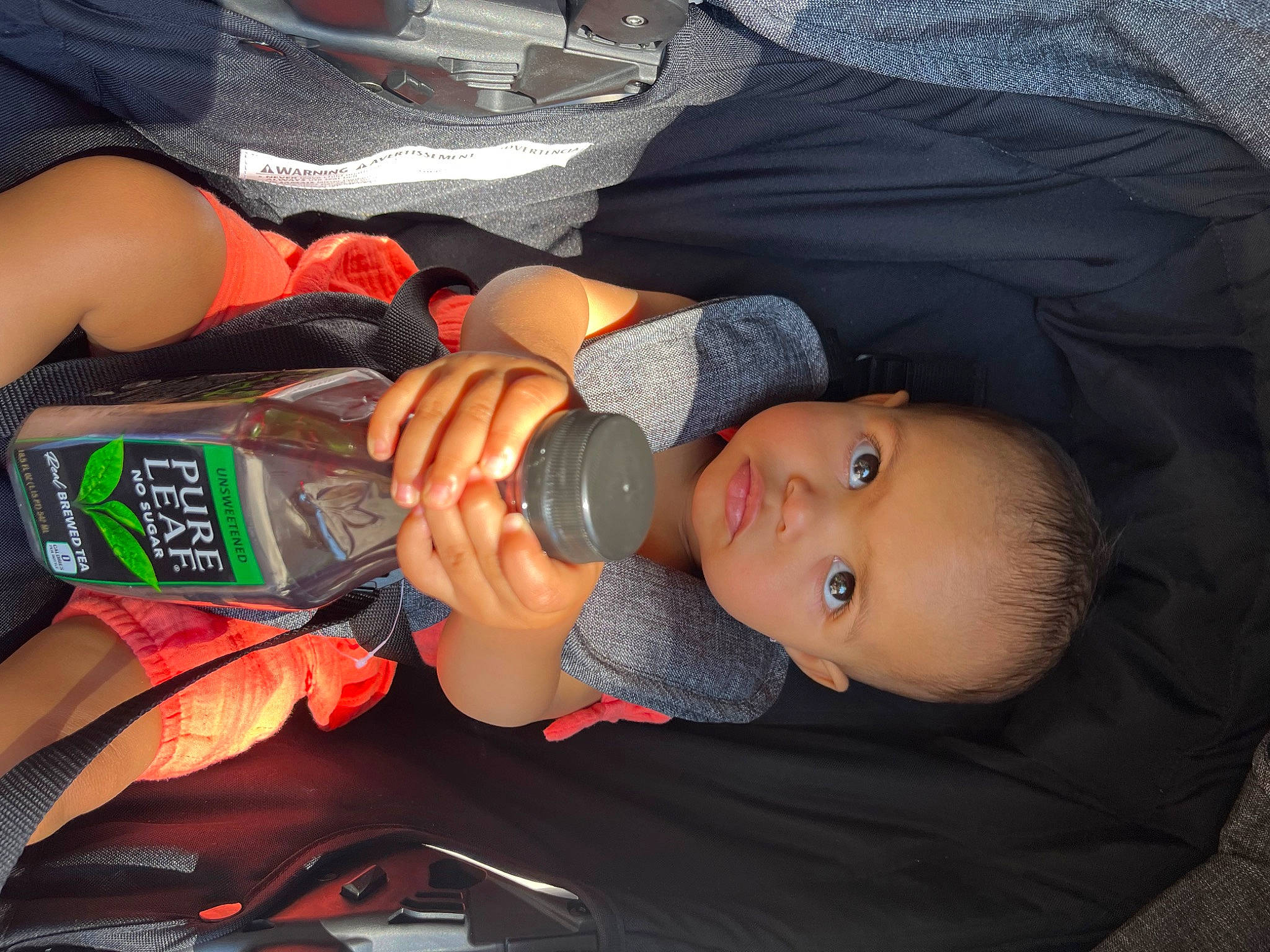 Illyana joined the competition — help win amazing prizes! baby, baby_products, bottle, car_seat, carmine, comfort, drink, drinkware, elbow, finger, fun, human_leg, mouth, nail, person, plastic_bottle, thigh, thumb, toddler, water_bottle