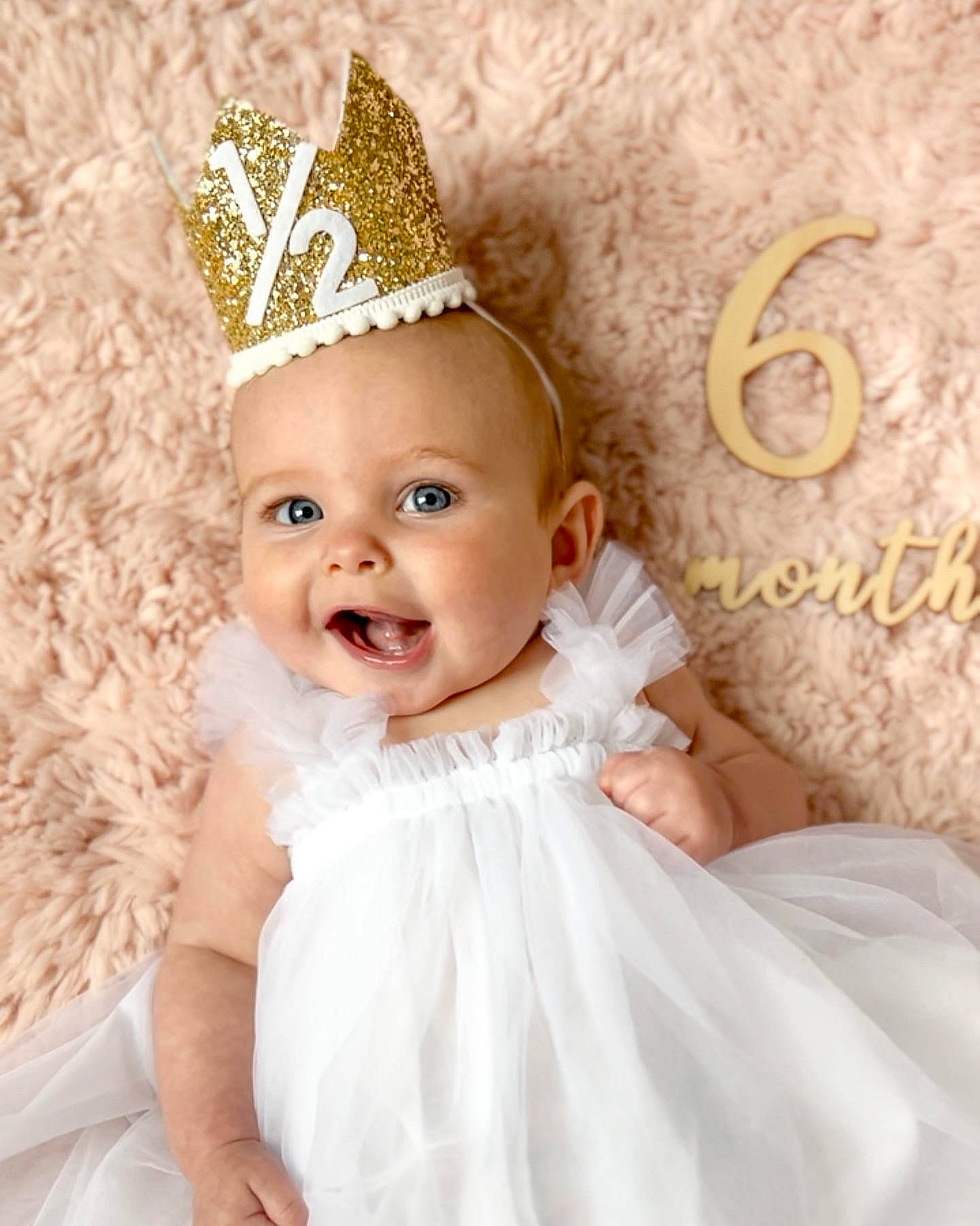 Gracelynne joined the competition — help win amazing prizes! baby, baby_toddler_clothing, bridal_accessory, cap, costume_hat, dress, event, happy, hat, headgear, headpiece, jewellery, party_hat, person, picture_frame, pink, smile, tiara, toddler, wedding_ceremony_supply