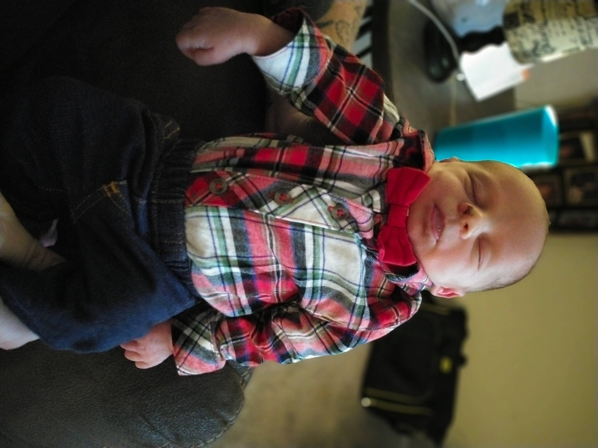 Cason is registered to the contest to win money with this photo: baby, child, comfort, elbow, event, finger, fun, human_leg, joint, lap, pattern, person, plaid, room, sitting, tartan, textile, toddler, tree