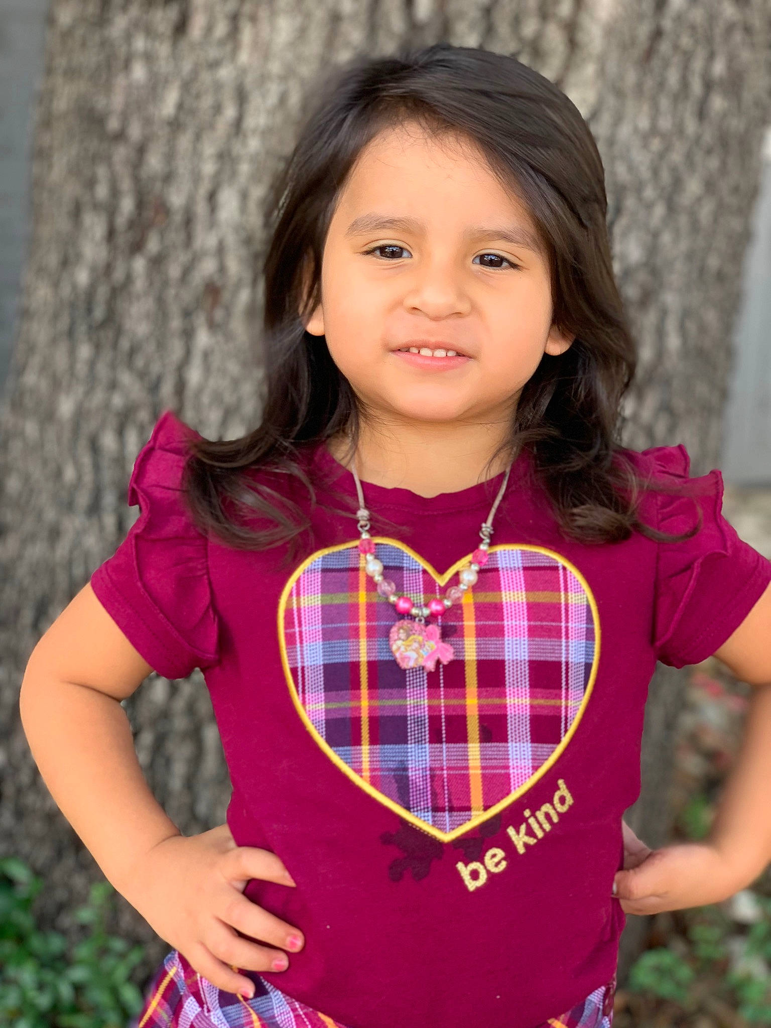 Jayda joined the competition — help win amazing prizes! arm, dress, face, flash_photography, grass, hair, hand, happy, iris, lip, outerwear, people_in_nature, person, pink, plaid, plant, skin, sleeve, tartan, toddler
