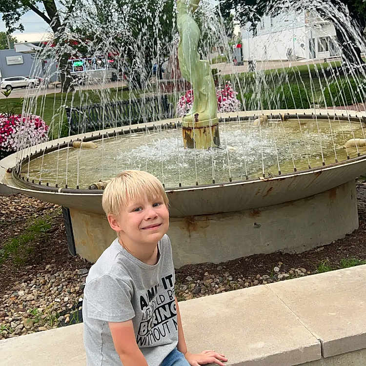 Grayson joined the competition — help win amazing prizes! architecture, boy, child, clothing, face, fountain, grass, head, jeans, male, nature, outdoors, pants, park, person, photography, plant, portrait, t_shirt, water