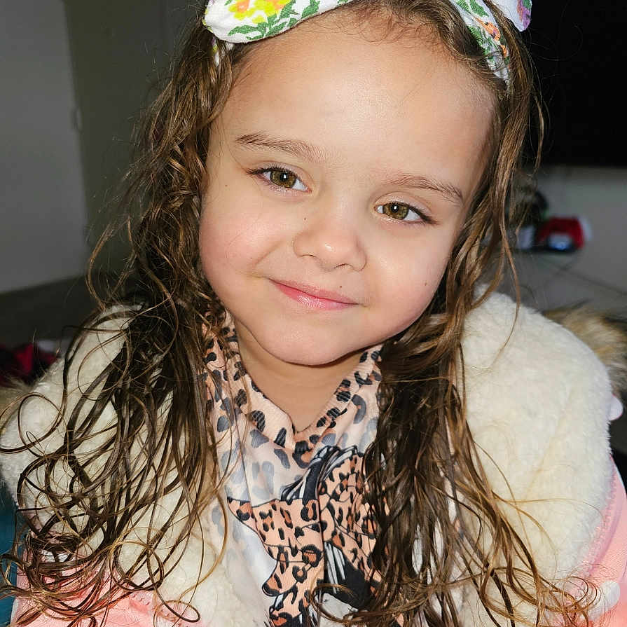 Sofia is registered to the contest to win money with this photo: accessories, bodypart, bonnet, cap, child, clothing, coat, face, female, girl, happy, hat, head, headband, jacket, person, photography, portrait, scarf, smile