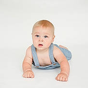 Marshall joined the competition — help win amazing prizes! baby, child, denim_overalls, blue_eyes, blonde_hair, infant, cute, crawling, white_background, soft_lighting, expression, portrait, skin, young_child, studio_photo, hands, face, curious, minimalistic, innocent