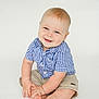 Marshall joined the competition — help win amazing prizes! baby, child, smiling, blue_checkered_shirt, shorts, sitting, barefoot, light_skin, blond_hair, cute, happy, portrait, studio, isolated, hands, feet, infant, one_person, indoors, white_background