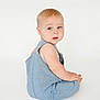 Marshall joined the competition — help win amazing prizes! baby, child, denim, romper, blue_eyes, light_hair, sitting, white_background, curious_expression, portrait, infant, casual_clothing, cute, young_child, skin, face, head, one_person, studio, minimalist