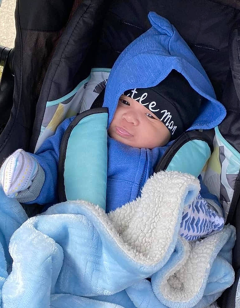 Cartier joined the competition — help win amazing prizes! auto_part, baby, baby_products, car_seat, child, comfort, electric_blue, headwear, person, sitting, toddler, winter