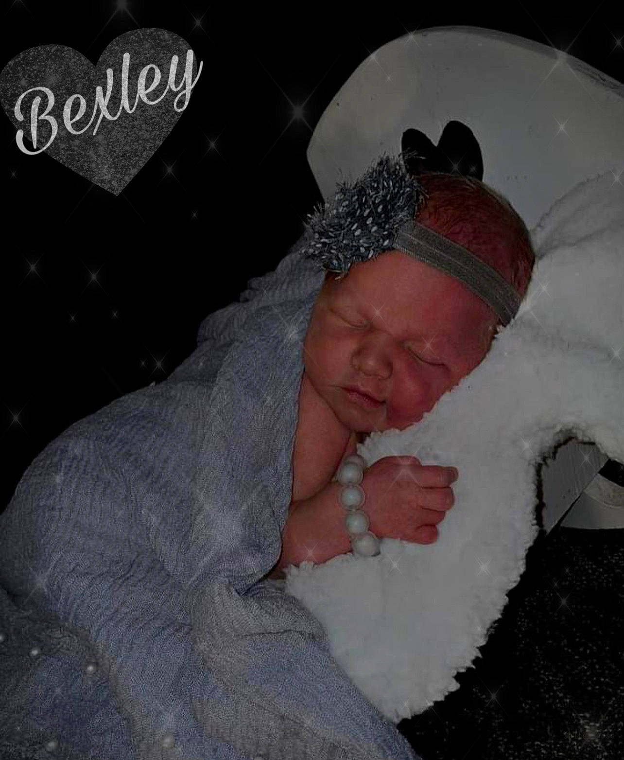 Bexley is registered to the contest to win money with this photo: baby, beanie, cap, cheek, child, comfort, eyebrow, freezing, fun, fur, knit_cap, linens, pattern, person, photo_caption, room, snow, thumb, toddler, winter