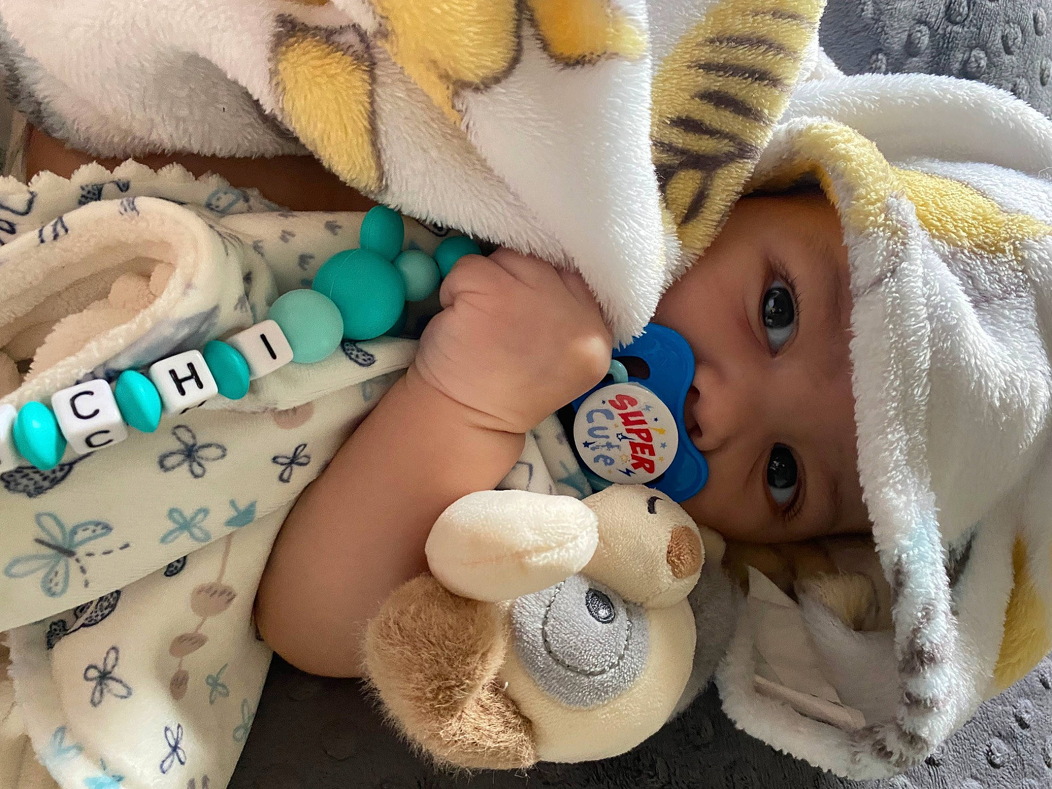 Malachi is registered to the contest to win money with this photo: baby, baby_products, baby_sleeping, baby_toddler_clothing, beauty, child, comfort, fashion_accessory, headgear, headwear, linens, mammal, pattern, person, plush, skin, stuffed_toy, textile, toddler, toy