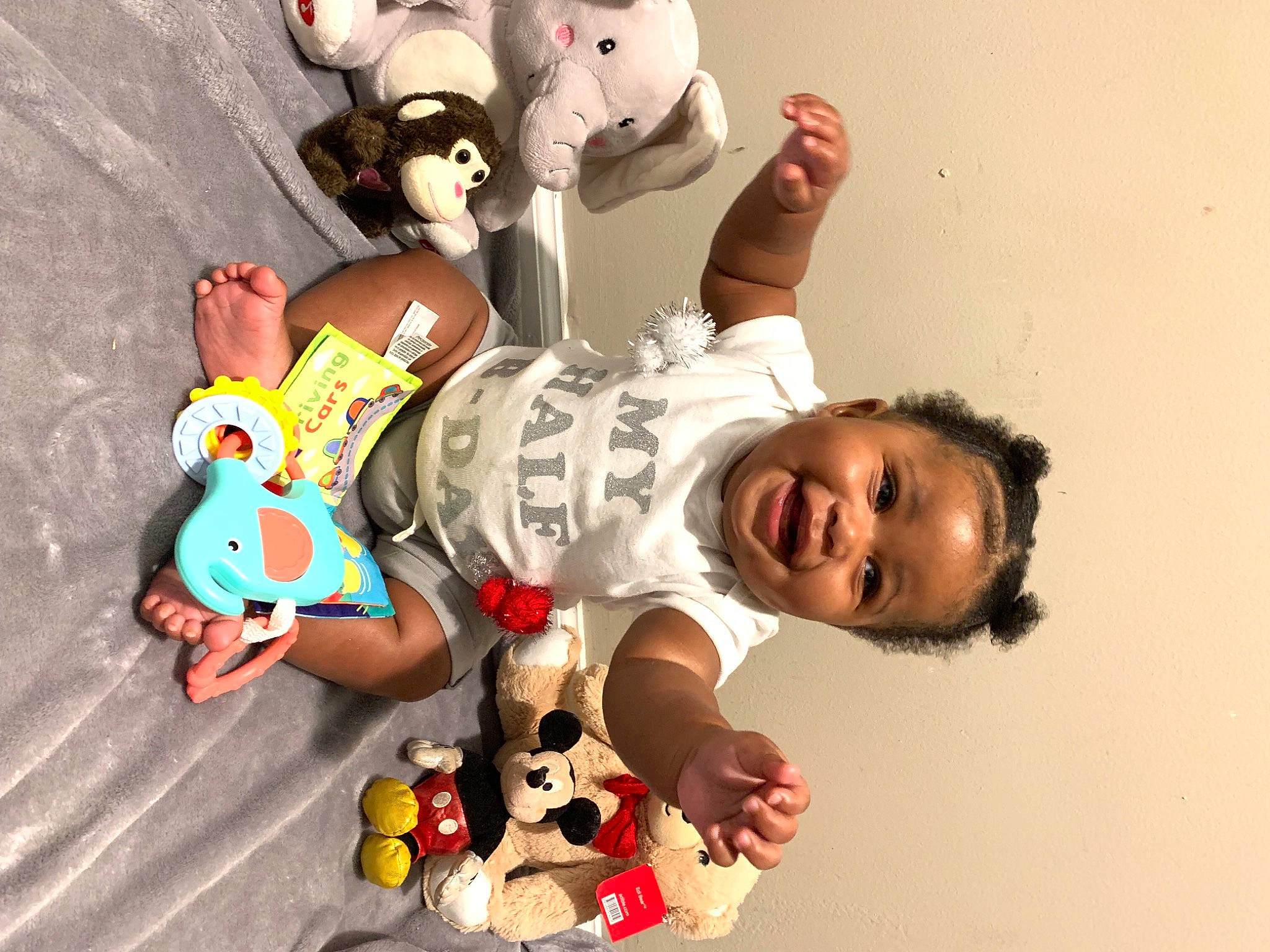 Messiah is registered to the contest to win money with this photo: animation, baby, baby_toddler_clothing, baby_toys, child, font, fun, gesture, happy, joint, leisure, mammal, person, play, smile, stuffed_toy, t_shirt, thumb, toddler, toy