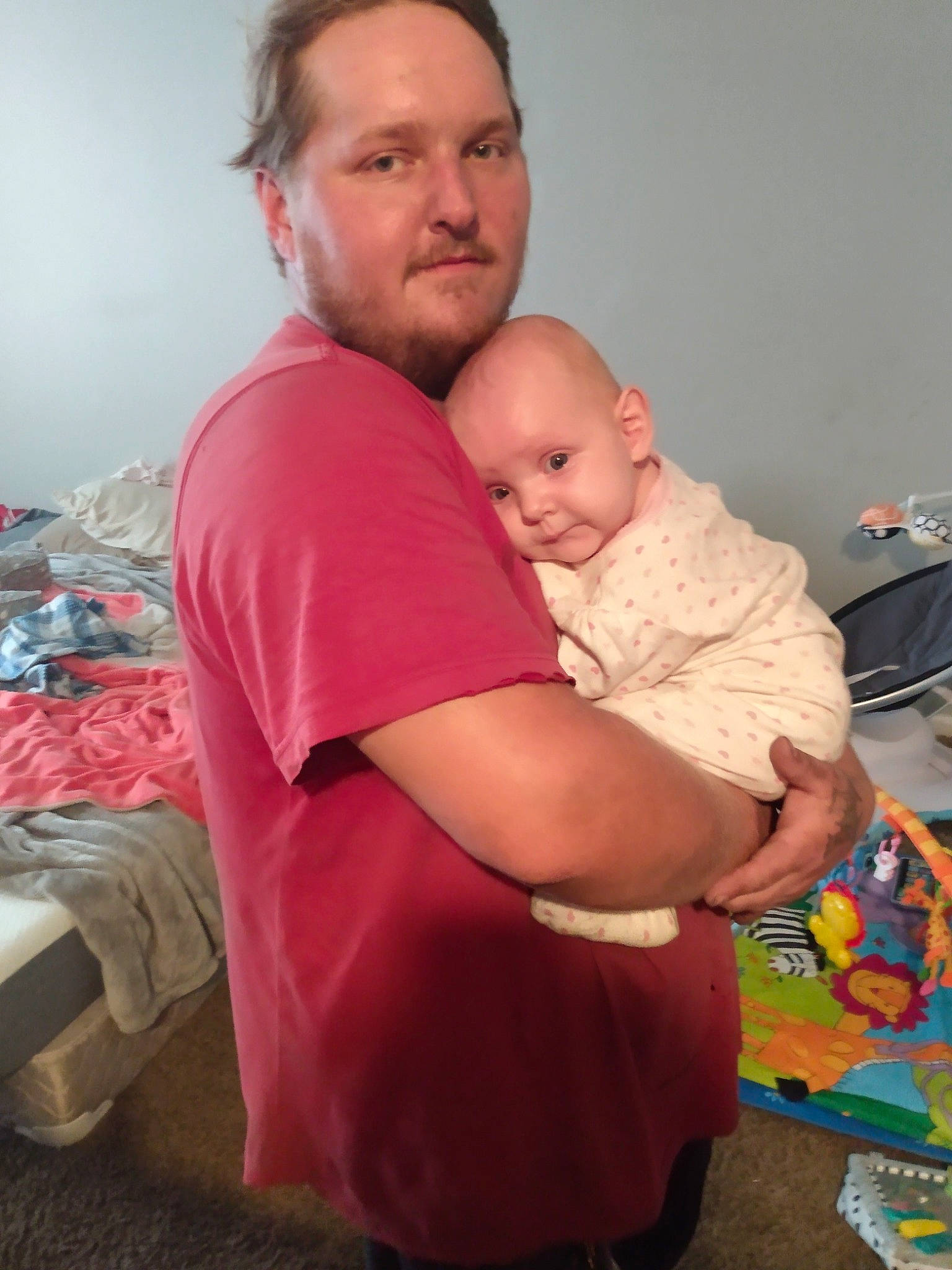 Lillith is registered to the contest to win money with this photo: abdomen, baby, bag, beard, cheek, chest, child, comfort, elbow, event, fun, happy, hug, lap, luggage_and_bags, person, room, sitting, t_shirt, toddler