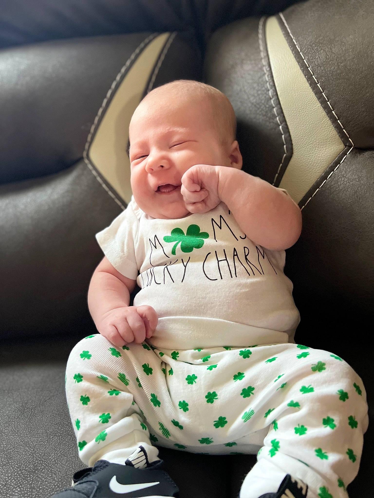 Langston joined the competition — help win amazing prizes! baby, baby_toddler_clothing, black, child, comfort, couch, finger, flash_photography, happy, knee, linens, neck, pattern, person, product, sitting, sleeve, smile, t_shirt, thigh