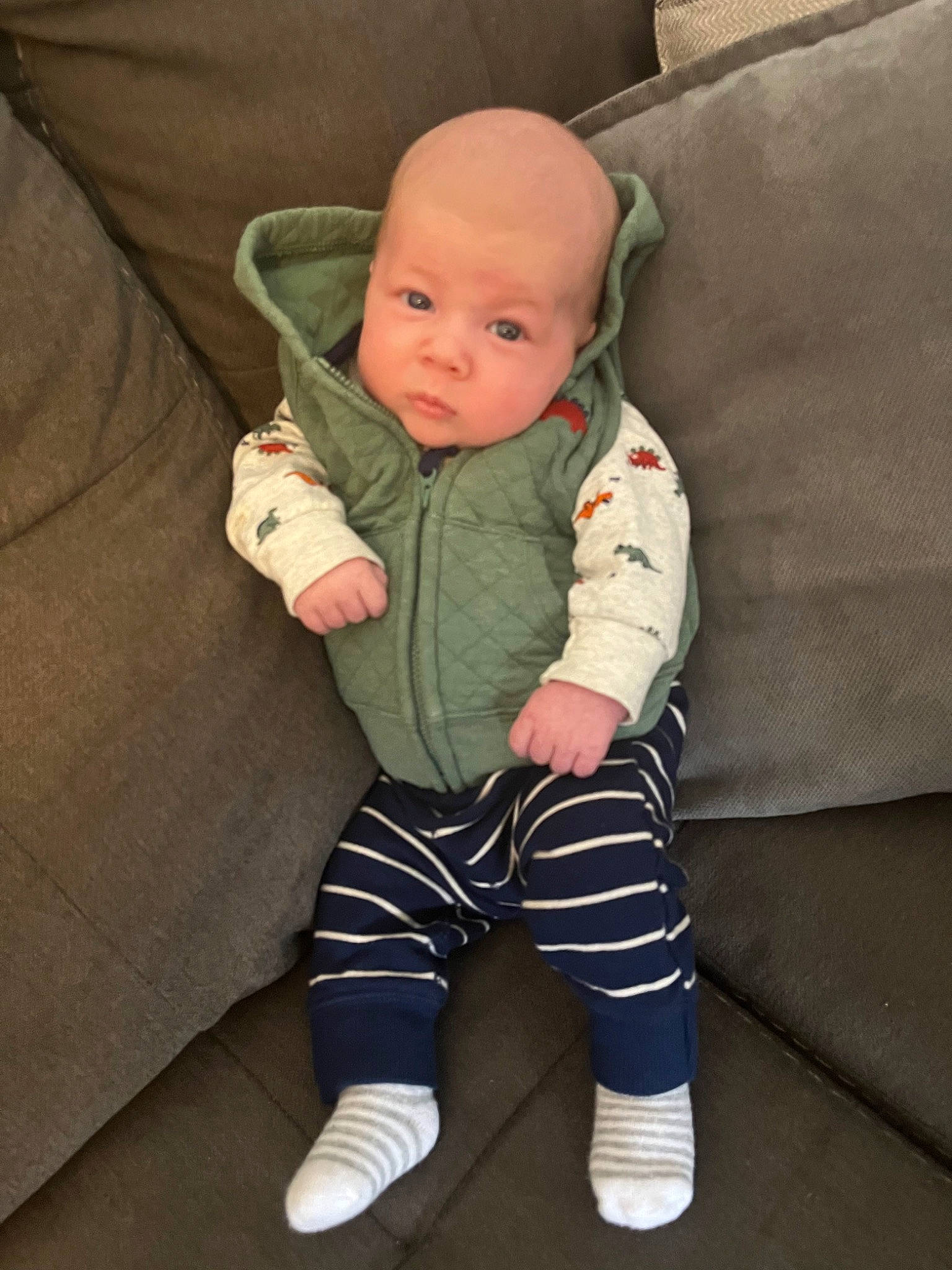 Langston is registered to the contest to win money with this photo: baby, baby_toddler_clothing, cheek, child, comfort, eye, head, human_body, human_leg, iris, knee, lap, leg, person, sitting, sleeve, sock, sportswear, t_shirt, thigh