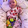 Pebble joined the competition — help win amazing prizes! baby, infant, onesie, strawberry_pattern, toy, turtle, ribbons, pillow, blanket, bed, cushion, indoor, child, cute, play, comfort, soft, sleepy, small_hands, colorful