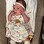 Pebble joined the competition — help win amazing prizes! baby, infant, child, headband, dress, sock, pacifier, beads, cushion, quilted, fabric, pattern, floral, white, beige, cute, lying_down, indoor, person, portrait