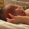 Kaycen joined the competition — help win amazing prizes! newborn, baby, infant, sleeping, face, head, hand, adult, parent, skin, hair, bed, blanket, indoors, portrait, closeup, resting, curled_up, warm_lighting, family