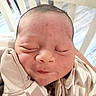 Kaycen is registered to the contest to win money with this photo: newborn, baby, infant, sleeping, face, portrait, crib, blanket, swaddle, onesie, clothing, indoors, nursery, bed, cozy, peaceful, closed_eyes, resting, head, photography