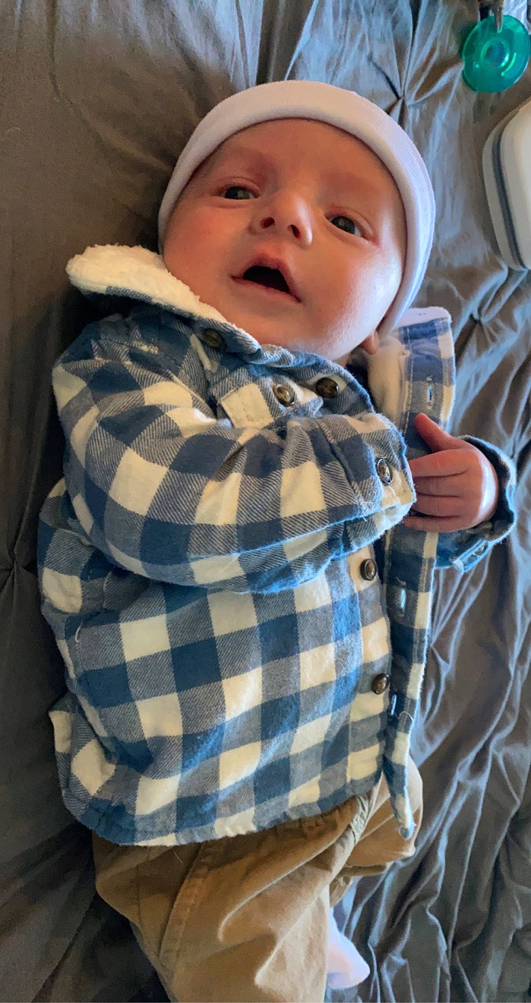 Gunnar is registered to the contest to win money with this photo: baby, baby_toddler_clothing, beanie, cap, cheek, child, chin, collar, comfort, dress_shirt, happy, linens, military_camouflage, pattern, person, plaid, sleeve, tartan, textile, toddler