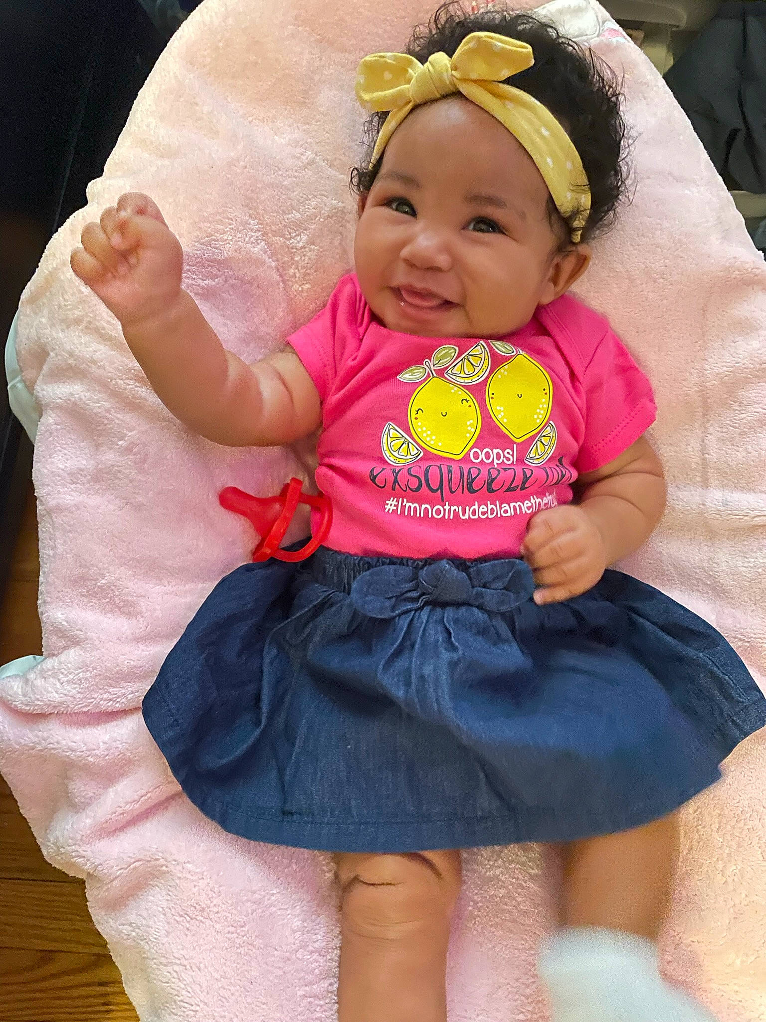 Chloe is registered to the contest to win money with this photo: baby, baby_laughing, baby_products, baby_toddler_clothing, cheek, child, facial_expression, fun, happy, headgear, headwear, iris, person, pink, purple, sitting, skin, sleeve, smile, t_shirt