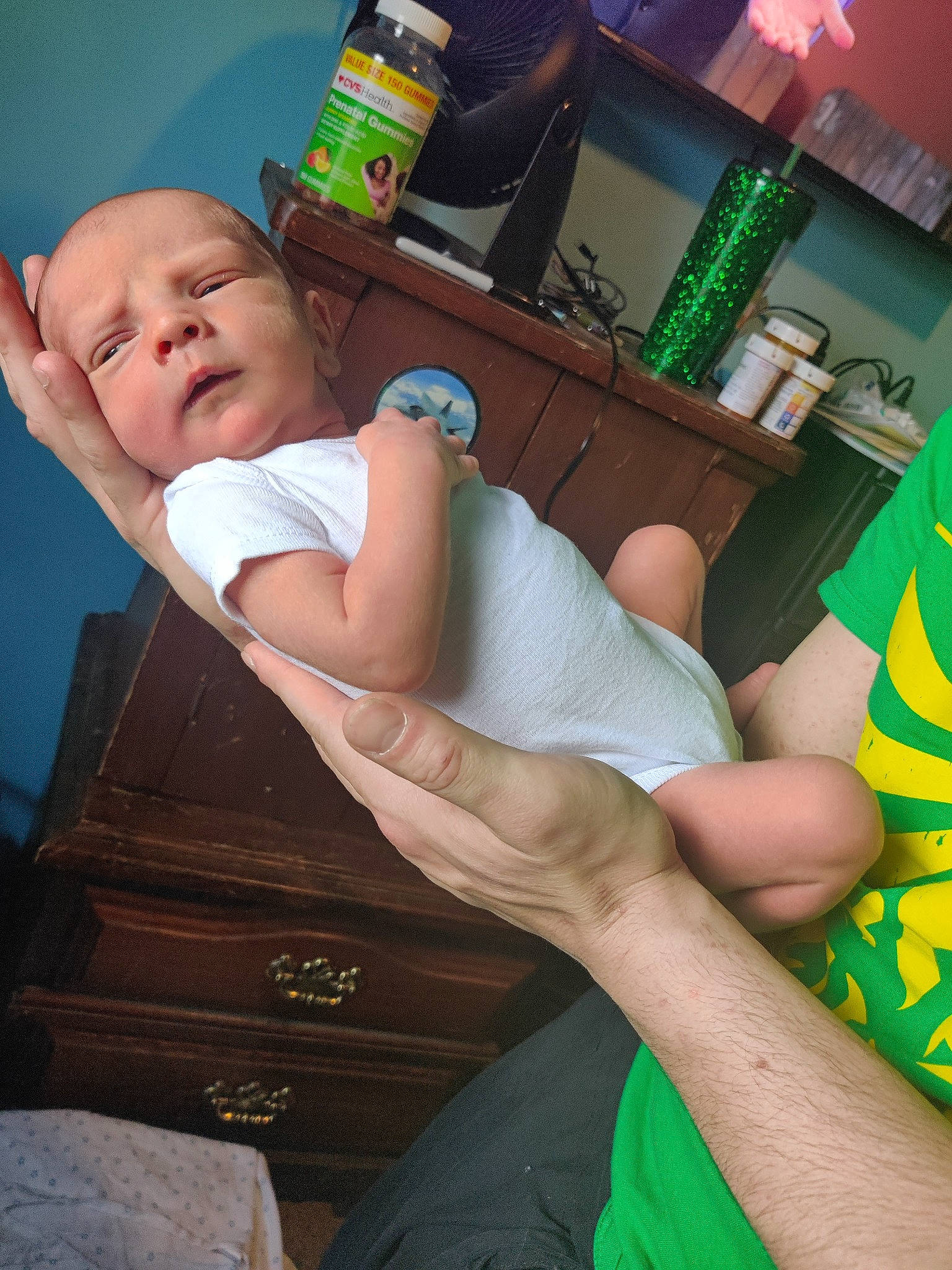 Maverick is registered to the contest to win money with this photo: abdomen, arm, chair, comfort, elbow, finger, furniture, glasses, green, human_body, joint, knee, mouth, muscle, person, photograph, skin, sunglasses, thigh, trunk