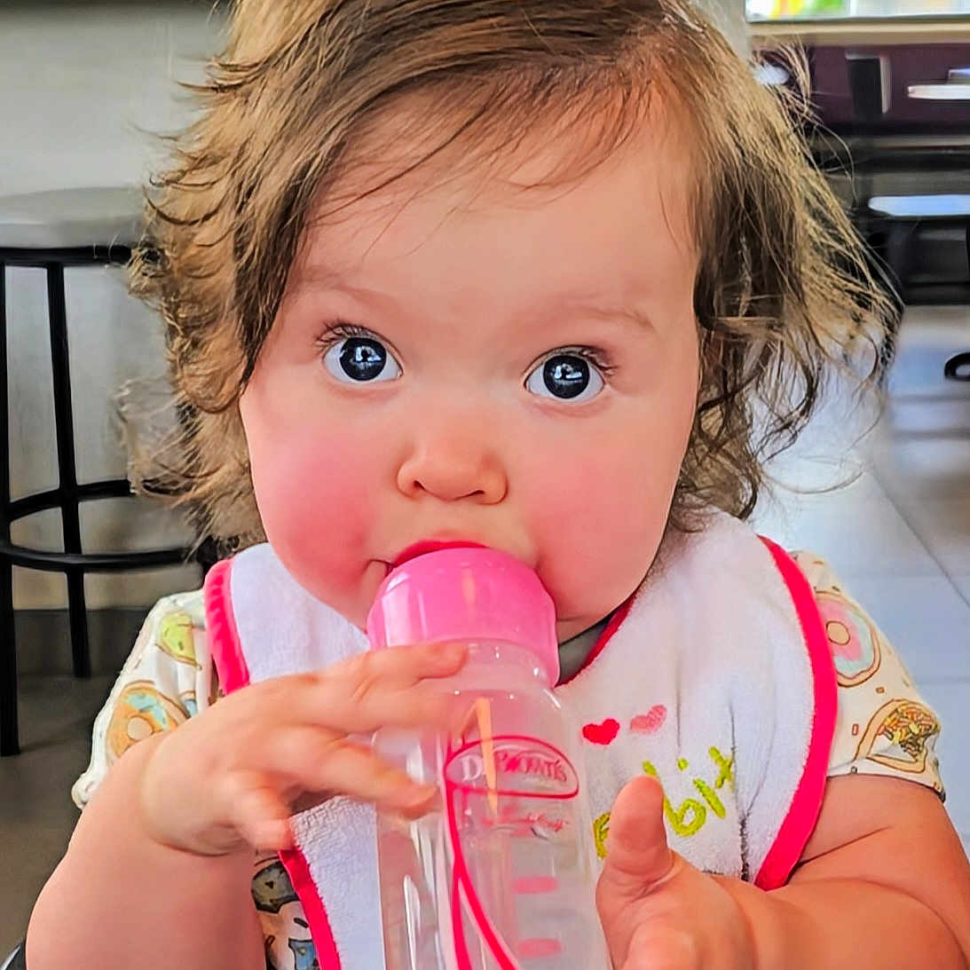 Laylah joined the competition — help win amazing prizes! baby, beverage, biting, bodypart, bottle, cream, dessert, drinking, eating, face, finger, food, hand, head, icecream, person, stain, waterbottle