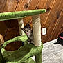 kitten, cat, cat_tree, scratching_post, indoor, wood_panel_wall, floor_tile, pet, animal, curious, pink_collar, small, cute, feline, young, domestic, playful, furniture, home, looking