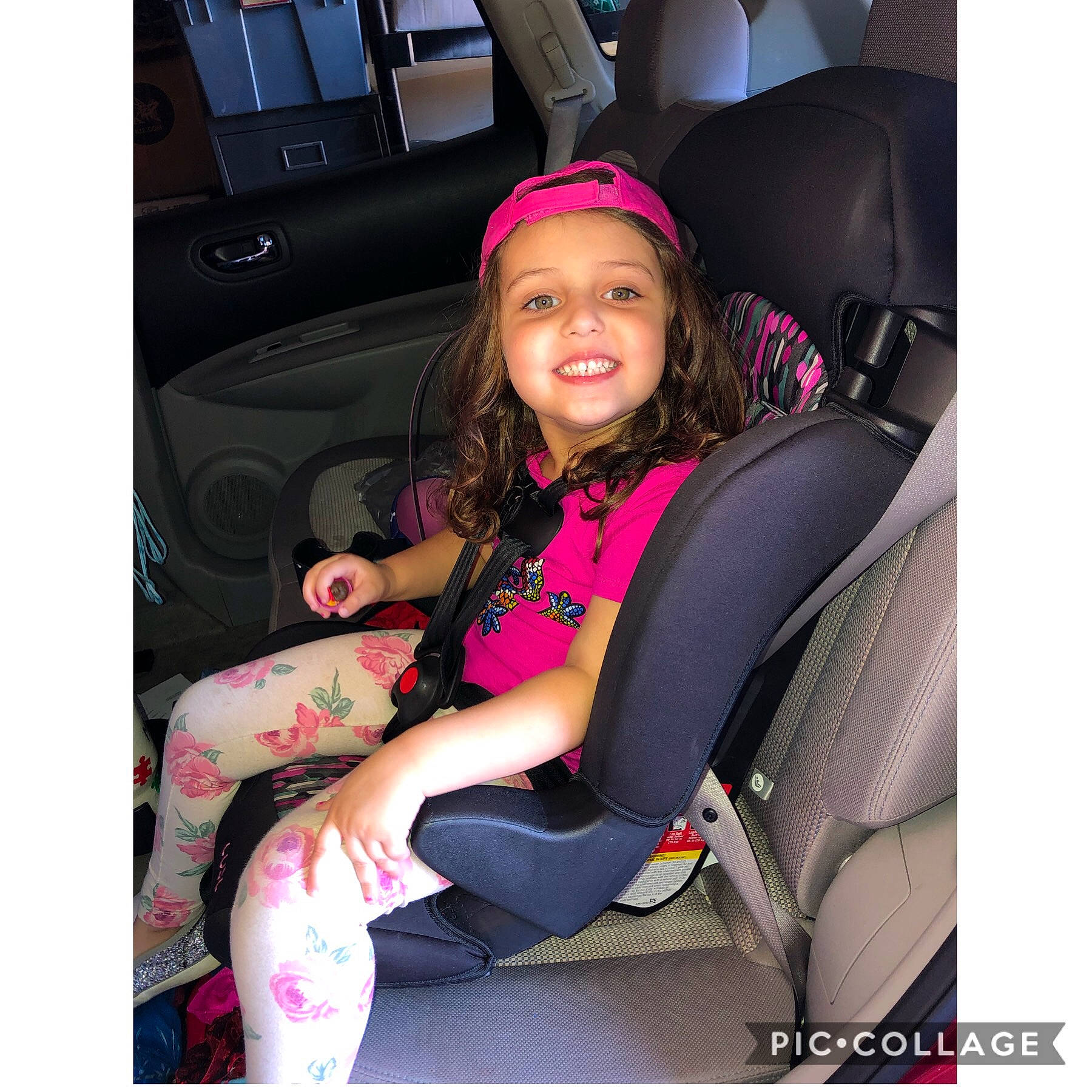 Mariyah is registered to the contest to win money with this photo: auto_part, car, car_seat, car_seat_cover, child, child_model, family_car, joy, person, pink, seat_belt, smile, toddler, vehicle