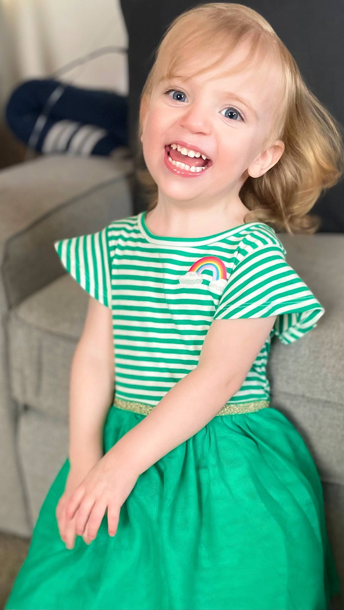 Berkeley is registered to the contest to win money with this photo: azure, baby_toddler_clothing, day_dress, dress, face, facial_expression, green, hairstyle, happy, head, iris, joy, one_piece_garment, person, pink, product, skin, sleeve, smile, standing