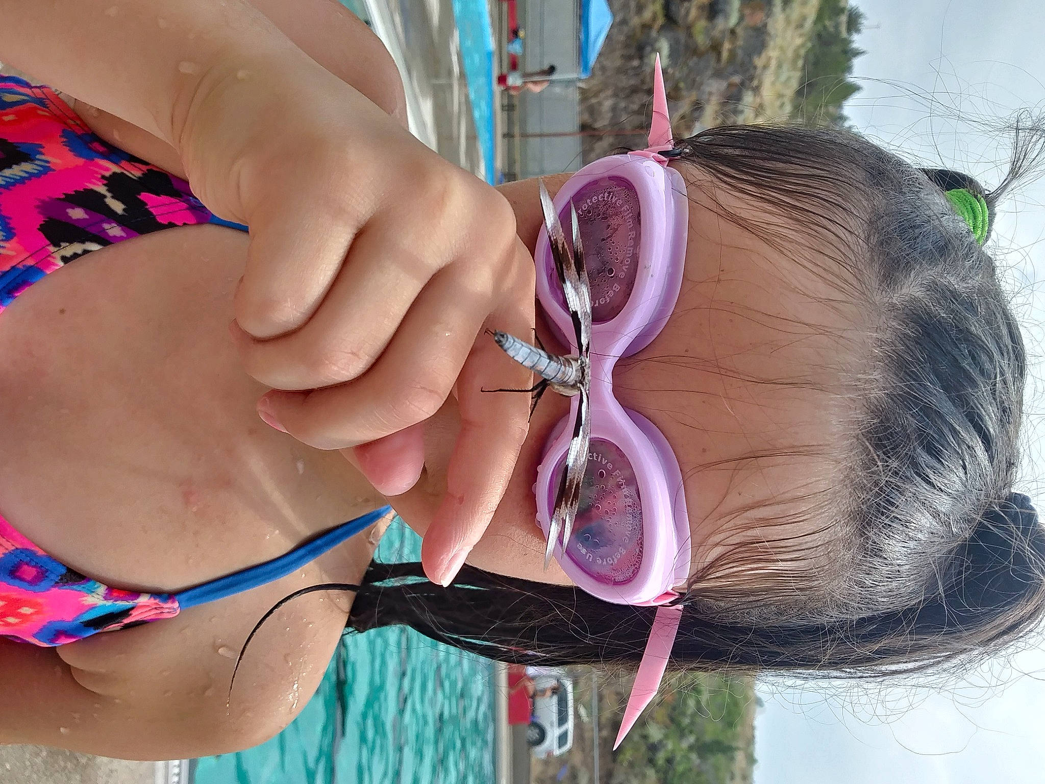 Londyn is registered to the contest to win money with this photo: black_hair, cool, eyelash, eyewear, finger, fun, hair, hairstyle, nail, neck, organ, photograph, pink, skin, swimsuit_top, swimwear, textile, thigh, vision_care, waist